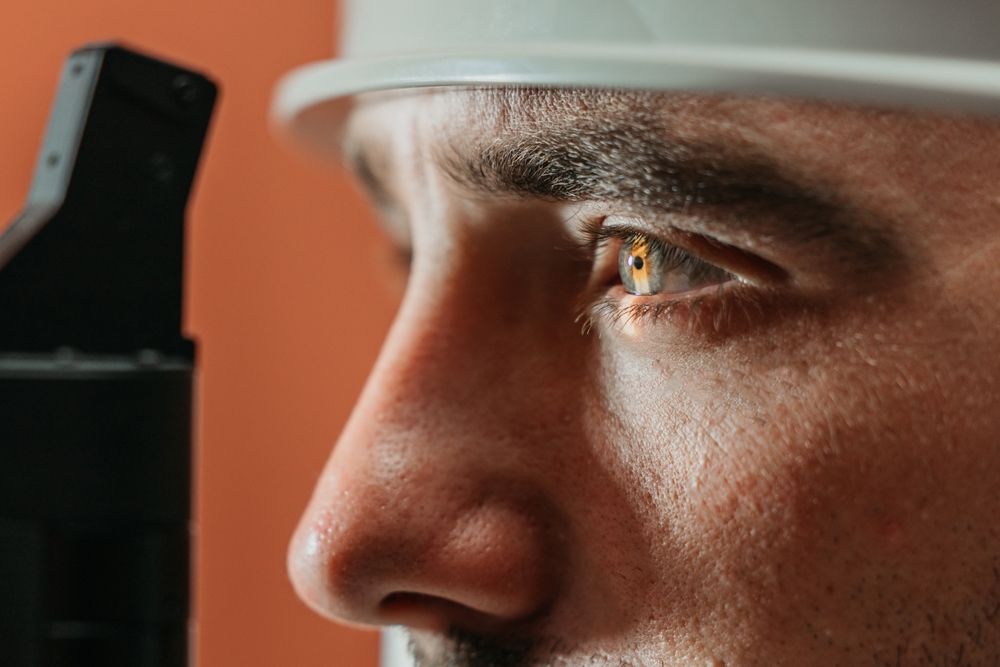 Ophthalmologist conducts a detailed eye examination with a slit lamp, highlighting the precision of the medical equipment and the patient's eye condition
